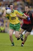 26 July 2003; Brendan Devenney, Donegal, in action against Down's Martin Cole. Bank of Ireland Senior Football Championship qualifier, Down v Donegal, St. Tighernach's Park, Clones, Co Monaghan. Picture credit; Ray McManus / SPORTSFILE *EDI*
