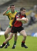 26 July 2003; Brendan Grant, Down, in action against Donegal's Jim McGuinness. Bank of Ireland Senior Football Championship qualifier, Down v Donegal, St. Tighernach's Park, Clones, Co Monaghan. Picture credit; Ray McManus / SPORTSFILE *EDI*