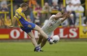 26 July 2003; Gerry Lohan of Roscommon in action against Killian Brennan of Kildare during the Bank of Ireland Senior Football Championship Qualifier between Kildare and Roscommon at O'Moore Park in Portlaoise, Laois. Photo by Damien Eagers/Sportsfile