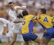 26 July 2003; John Doyle of Kildare in action against Francie Grehan, 6, and John Whyte of Roscommon during the Bank of Ireland Senior Football Championship Qualifier between Kildare and Roscommon at O'Moore Park in Portlaoise, Laois. Photo by Damien Eagers/Sportsfile