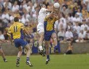 26 July 2003; Seamus O'Neill of Roscommon in action against Killian Brennan of Kildare during the Bank of Ireland Senior Football Championship Qualifier between Kildare and Roscommon at O'Moore Park in Portlaoise, Laois. Photo by Damien Eagers/Sportsfile