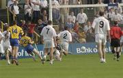26 July 2003; John Tiernan of Roscommon shoots past Kildare goalkeeper Enda Murphy to score his sides first goal. during the Bank of Ireland Senior Football Championship Qualifier between Kildare and Roscommon at O'Moore Park in Portlaoise, Laois. Photo by Damien Eagers/Sportsfile