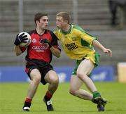 26 July 2003; Aidan Scullion, Down, in action against Donegal's Stephen McDermott. Bank of Ireland Senior Football Championship qualifier, Down v Donegal, St. Tighernach's Park, Clones, Co Monaghan. Picture credit; Ray McManus / SPORTSFILE *EDI*