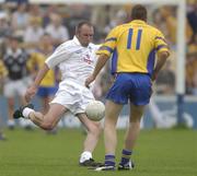 26 July 2003;Glenn Ryan of Kildare in action against Gerry Lohan of Roscommon during the Bank of Ireland Senior Football Championship Qualifier between Kildare and Roscommon at O'Moore Park in Portlaoise, Laois. Photo by Damien Eagers/Sportsfile