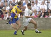 26 July 2003; Ken Donnelly of Kildare in action against David Casey of Roscommon during the Bank of Ireland Senior Football Championship Qualifier between Kildare and Roscommon at O'Moore Park in Portlaoise, Laois. Photo by Damien Eagers/Sportsfile