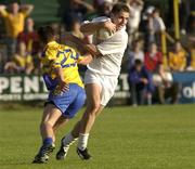26 July 2003; Mick Wright of Kildare in action against Brian Higgins of Roscommon during the Bank of Ireland Senior Football Championship Qualifier between Kildare and Roscommon at O'Moore Park in Portlaoise, Laois. Photo by Damien Eagers/Sportsfile