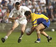 26 July 2003; Francie Grehan of Roscommon in action against John Doyle of Kildare during the Bank of Ireland Senior Football Championship Qualifier between Kildare and Roscommon at O'Moore Park in Portlaoise, Co. Laois. Photo by Damien Eagers/Sportsfile