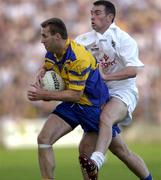 26 July 2003; Michael Ryan of Roscommon in action against Padraig Brennan of Kildare during the Bank of Ireland Senior Football Championship Qualifier between Kildare and Roscommon at O'Moore Park in Portlaoise, Laois. Photo by Damien Eagers/Sportsfile