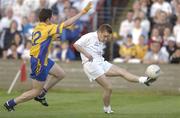 26 July 2003; Eddie McCormack of Kildare in action against John Tiernan of Roscommon during the Bank of Ireland Senior Football Championship Qualifier between Kildare and Roscommon at O'Moore Park in Portlaoise, Co. Laois. Photo by Damien Eagers / Sportsfile