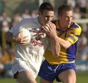26 July 2003; Padraig Hurley of Kildare in action against Morgan Beirne of Roscommon during the Bank of Ireland Senior Football Championship Qualifier between Kildare and Roscommon at O'Moore Park in Portlaoise, Co. Laois. Photo by Damien Eagers/Sportsfile