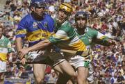 27 July 2003; Eoin Kelly of Tipperary in action against Ger Oakley of Offaly during the Guinness All-Ireland Senior Hurling Championship Quarter Final match between Offaly and Tipperary at Croke Park in Dublin. Photo by Pat Murphy / Sportsfile