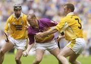 27 July 2003; Larry Murphy of Wexford in action against Kieran Kelly, right, and Ciaran Herron of Antrim during the Guinness All-Ireland Senior Hurling Championship Quarter Final between Wexford v Antrim at Croke Park in Dublin. Photo by Pat Murphy/Sportsfile