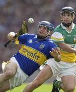 27 July 2003; Eoin Kelly of Tipperary in action against David Franks of Offaly during the Guinness All-Ireland Senior Hurling Championship Quarter Final match between Offaly and Tipperary at Croke Park in Dublin. Photo by Ray McManus/Sportsfile
