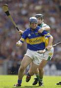 27 July 2003; Eoin Kelly of Tipperary in action against David Franks of Offaly during the Guinness All-Ireland Senior Hurling Championship Quarter Final match between Offaly and Tipperary at Croke Park in Dublin. Photo by Ray McManus/Sportsfile
