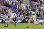 27 July 2003; Brian O'Meara of Tipperary in action against Colm Cassidy of Offaly during the Guinness All-Ireland Senior Hurling Championship Quarter Final match between Offaly and Tipperary at Croke Park in Dublin. Photo by Ray McManus/Sportsfile