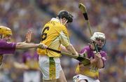 27 July 2003; Kary McKeegan of Antrim in action against Michael Jordan, left, and Paul Codd of Wexford during the Guinness All-Ireland Senior Hurling Championship Quarter Final between Wexford v Antrim at Croke Park in Dublin. Photo by Pat Murphy/Sportsfile