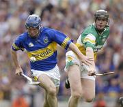 27 July 2003; Eoin Kelly of Tipperary in action against Rory Hannify of Offaly during the Guinness All-Ireland Senior Hurling Championship Quarter Final match between Offaly and Tipperary at Croke Park in Dublin. Photo by Ray McManus/Sportsfile