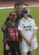 28 July 2003; Karoline Dragen, (11) wearing the Rosenborg BK colours and Alastair Conroy(12) wearing the Bohemians colours with Bohemians manager Stephen Kenny are pictured to announce eircom League Champions Bohemian's crucial UEFA Champions League second qualifying round clash with Norwegian side Rosenborg BK, Dalymount Park, Dublin.  Picture credit; Damien Eagers / SPORTSFILE *EDI*