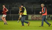 11 November 2017; An Ulster council official takes a dog of the field after stopping the game during the AIB Ulster GAA Football Senior Club Championship Semi-Final match between Kilcar and Slaughtneil at Healy Park in Omagh, Tyrone. Photo by Oliver McVeigh/Sportsfile