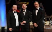 3 November 2017; Warwickshire hurler John Collins is presented with his Lory Meagher Champion 15 award by Uachtarán Chumann Lúthchleas Gael Aogán Ó Fearghail, left, and David Collins, GPA President, during the PwC All Stars 2017 at the Convention Centre in Dublin. Photo by Piaras Ó Mídheach/Sportsfile