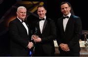 3 November 2017; Tyrone hurler Stephen Donnelly is presented with his Nicky Rackard Champion 15 award by Uachtarán Chumann Lúthchleas Gael Aogán Ó Fearghail, left, and David Collins, GPA President, during the PwC All Stars 2017 at the Convention Centre in Dublin.