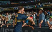 12 November 2017; Michael Hibberd of Australia celebrates with supporters after the Virgin Australia International Rules Series 1st test at the Adelaide Oval in Adelaide, Australia. Photo by Ray McManus/Sportsfile