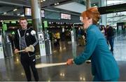 17 November 2017; Galway hurlers departed Dublin Airport for Boston today onboard Aer Lingus flight EI137. Aer Lingus, official airline of the AIG Fenway Hurling Classic and Irish Festival, has been serving Boston since 1958 and is thrilled to once again be supporting this unique cultural and sporting event, bringing 130 hurlers to Boston’s iconic Fenway Park. Games will be broadcast on TG4 on November 19th with Dublin v Galway in the first semi-final followed by Clare v Tipperary in the second semi-final. Pictured is Aer Lingus cabin crew member Olive Bohan with Galway's Joe Canning. Photo by Ramsey Cardy/Sportsfile