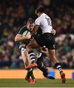 18 November 2017; Chris Farrell of Ireland is tackled by Ben Volavola, right, and Dominiko Waqaniburotu of Fiji, behind, during the Guinness Series International match between Ireland and Fiji at the Aviva Stadium in Dublin. Photo by Seb Daly/Sportsfile