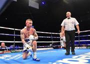 18 November 2017; Carl Frampton recovers from a knock down by Horacio Garcia during their featherweight bout at the SSE Arena in Belfast. Photo by Ramsey Cardy/Sportsfile