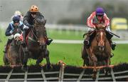 19 November 2017; Top Othe Ra, with David Mullins up, right, leads Yaha Fizz, with Ryan Treacy up, over the last on their way to winning the handicap hurdle at Punchestown Racecourse in Naas, Co Kildare. Photo by Ramsey Cardy/Sportsfile