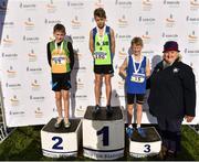 26 November 2017; Silver medalist Fionn McNamara of Annalee A.C., left, gold medalist Thomas Bolton of Metro/St. Brigid's A.C., centre, and bronze medalist Ben Walsh of Nenagh Olympic A.C. with Georgina Drumm, President of Athletics Ireland, after the U12 Boys race during the Irish Life Health Juvenile Even Age Cross Country Championships 2017 at the National Sports Campus in Abbotstown, Dublin. Photo by David Fitzgerald/Sportsfile