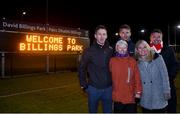 30 November 2017; Annette Billings, widow of the late David Billings, and her children, from left, Neal, Cathal, Hannah, and Liam, in front of the new scoreboard dedicated to Billings, ahead of the Official Opening of Billings Park match between UCD and Dublin at Billings Park in UCD, Dublin. Photo by Cody Glenn/Sportsfile