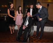 2 December 2017; Dublin captain Stephen Cluxton, together with Allison, Eva and Conail makes a presentation to Antrim senior football captain Anto Finnegan who was the guest of honour at the  All-Ireland medal presentation in the InterContinental Dublin in Ballsbridge, Dublin. Photo by Ray McManus/Sportsfile