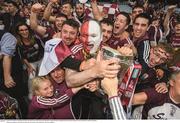 3 September 2017; Tom Brennan, from Clarinbridge, and his fellow Galway supporters celebrate with the Liam MacCarthy Cup following the GAA Hurling All-Ireland Senior Championship Final match between Galway and Waterford at Croke Park in Dublin. Photo by Stephen McCarthy/Sportsfile    This image may be reproduced free of charge when used in conjunction with a review of the book &quot;A Season of Sundays 2017&quot;. All other usage © SPORTSFILE