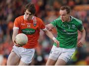 25 June 2017; Andrew Murnin of Armagh in action against Che Cullen of Fermanagh during the GAA Football All-Ireland Senior Championship Round 1B match between Armagh and  Fermanagh at the Athletic Grounds in Armagh. Photo by Philip Fitzpatrick/Sportsfile  This image may be reproduced free of charge when used in conjunction with a review of the book &quot;A Season of Sundays 2017&quot;. All other usage © SPORTSFILE