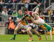 11 June 2017; Kieran Martin of Westmeath in action against Seán Pender and Niall Darby, left, of Offaly during the Leinster GAA Football Senior Championship Quarter-Final match between Offaly and Westmeath at Bord Na Móna O'Connor Park, Tullamore, in Co. Offaly. Photo by Piaras Ó Mídheach/Sportsfile    This image may be reproduced free of charge when used in conjunction with a review of the book &quot;A Season of Sundays 2017&quot;. All other usage © SPORTSFILE