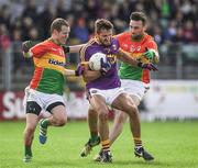 21 May 2017; Brian Malone of Wexford in action against Danny Moran, left, and Eoghan Ruth of Carlow during the Leinster GAA Football Senior Championship Round 1 match between Carlow and Wexford at Netwatch Cullen Park in Carlow. Photo by Ramsey Cardy/Sportsfile