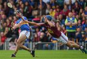 1 July 2017; Aidan McCormack of Tipperary is blocked down by Gary Greville of Westmeath during the GAA Hurling All-Ireland Senior Championship Round 1 match between Tipperary and Westmeath at Semple Stadium in Thurles, Co Tipperary. Photo by Diarmuid Greene/Sportsfile  This image may be reproduced free of charge when used in conjunction with a review of the book &quot;A Season of Sundays 2017&quot;. All other usage © SPORTSFILE