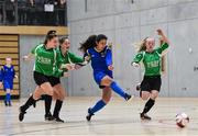 05 December 2017; Sophie Murphy of Carndonagh Community College, Co. Donegal, shoots to score her side's first goal despite the attention of Sophie Thompson, Claragh Callanan, and Lya Gilooly of Presentation Secondary School, Ballpheane, Co. Cork, during the FAI Post Primary Schools Futsal Finals at Waterford IT Indoor Arena in Waterford.  Photo by Seb Daly/Sportsfile