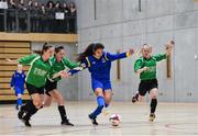 05 December 2017; Sophie Murphy of Carndonagh Community College, Co. Donegal, shoots to score her side's first goal despite the attention of Sophie Thompson, Claragh Callanan, and Lya Gilooly of Presentation Secondary School, Ballpheane, Co. Cork, during the FAI Post Primary Schools Futsal Finals at Waterford IT Indoor Arena in Waterford.  Photo by Seb Daly/Sportsfile
