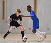 05 December 2017; Michael Okocka of St. Joseph's College, Co. Galway, in action against Kevin Lyons of St. Francis College, Rochestown, Co. Cork, during the FAI Post Primary Schools Futsal Finals at Waterford IT Indoor Arena in Waterford.  Photo by Seb Daly/Sportsfile