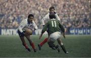 19 February 1983; Serge Blanco, France, in action against Moss Finn, Ireland. Ireland v France. Lansdowne Road, Dublin, Ireland. Ireland 22 France 16. Photo by SPORTSFILE