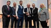 6 December 2017; Clonliffe Harriers AC representatives, Brian Gregan, Joe Cooper, club captain, and Gary O'Hanlon accept the Club of the Year Award from Minister of State at the Department of Transport, Tourism and Sport, Brendan Griffin T.D, left, Jim Dowdall, Managing Director at Irish Life Health, second from left, and Georgina Drumm, President of Athletics Ireland, during the Irish Life Health National Athletics Awards 2017 at Crowne Plaza in Santry, Dublin. Photo by Piaras Ó Mídheach/Sportsfile