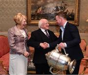 8 December 2017; Galway's Davy Glennon, carrying the Bob O'Keeffe Cup, is welcomed by the President of Ireland Michael D Higgins and his wife Sabina during the GAA Hurling All-Ireland Senior & Minor Champions visit to Áras an Uachtaráin in Phoenix Park, Dublin. Photo by Stephen McCarthy/Sportsfile