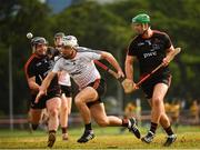 9 December 2017; Dathí Burke of 2016 PwC All Star Team in action against Noel Connors, left, and Matthew O'Hanlon of 2017 PwC All Star Team during the PwC All Star Tour 2017 - All Star Hurling game at the Singapore Recreation Club, The Pandang, in Singapore. Photo by Ray McManus/Sportsfile