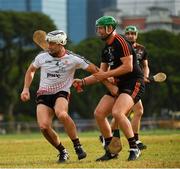 9 December 2017; Dathí Burke of  2016 PwC All Star Team in action against Matthew O'Hanlon of 2017 PwC All Star Team  during the PwC All Star Tour 2017 - All Star Hurling game at the Singapore Recreation Club, The Pandang, in Singapore. Photo by Ray McManus/Sportsfile