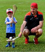 10 December 2017;  Eoin Murphy of Kilkenny with Flynn Trundle, two years, during a coaching session and end of season medal presentations at the Singapore Gaelic Lions GAA training session at The Grandstand, Turf Club Rd, Bukit Timah, Singapore  Photo by Ray McManus/Sportsfile