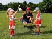 10 December 2017; GPA President David Collins with Isabelle Smith, 3 years, and Sean O'Brien during a coaching session and end of season medal presentations at the Singapore Gaelic Lions GAA training session at The Grandstand, Turf Club Rd, Bukit Timah, Singapore  Photo by Ray McManus/Sportsfile