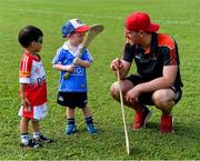 10 December 2017;  Eoin Murphy of Kilkenny with Flynn Trundle, two years, and Natham Ng, 3 1/2 years, during a coaching session and end of season medal presentations at the Singapore Gaelic Lions GAA training session at The Grandstand, Turf Club Rd, Bukit Timah, Singapore  Photo by Ray McManus/Sportsfile
