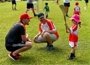 10 December 2017; Eoin Murphy of Kilkenny with Keke Hoskin, four years, and her dad Ken during a coaching session and end of season medal presentations at the Singapore Gaelic Lions GAA training session at The Grandstand, Turf Club Rd, Bukit Timah, Singapore  Photo by Ray McManus/Sportsfile